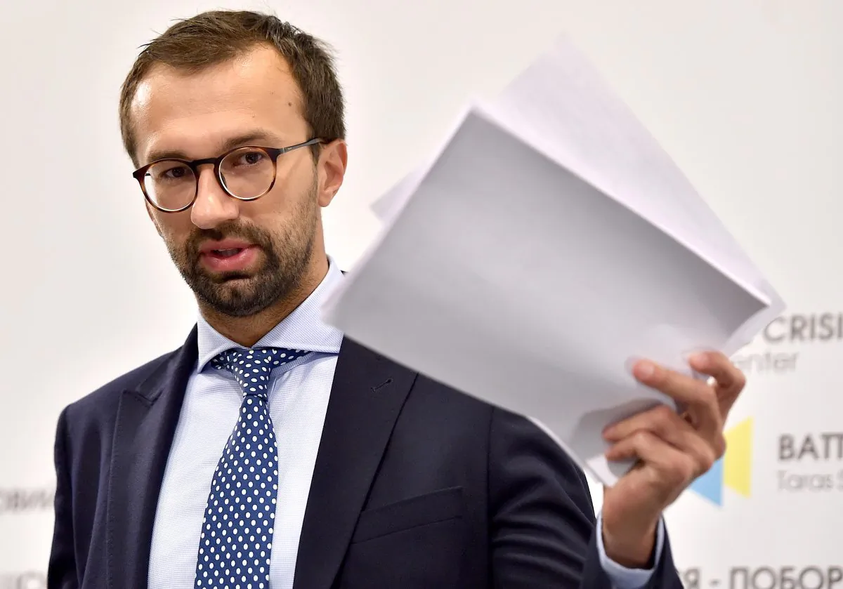 Ukrainian member of parliament Serhiy Leshchenko holds pages showing allegedly signings of payments to Paul Manafort from an illegal shadow accounting book of the party of former Ukrainian President Viktor Yanukovych, in Kyiv on Aug. 19, 2016. (Sergei Supinsky/AFP/Getty Images)