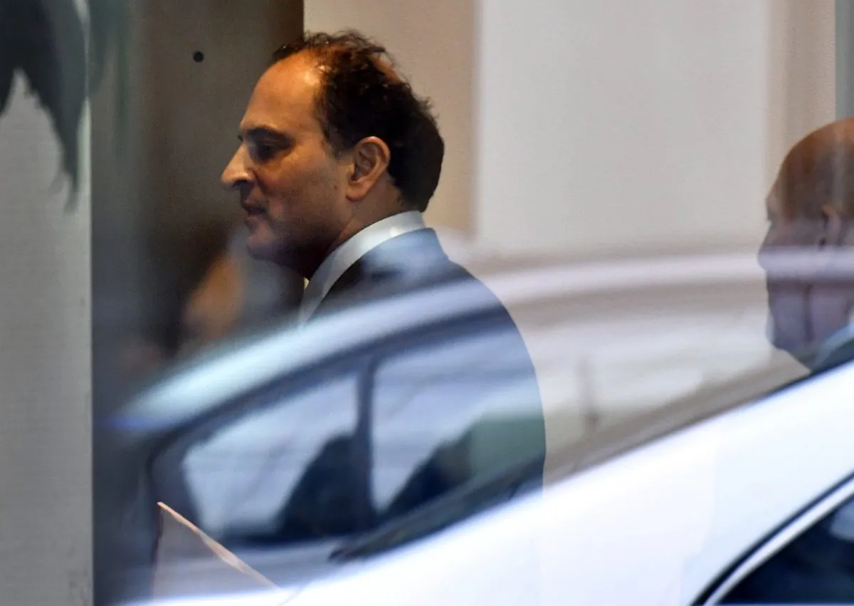 David Sidoo, of Vancouver, Canada, enters an adjacent building with his lawyer following a federal court hearing , in Boston on March 15, 2019.  (Josh Reynolds/AP Photo)