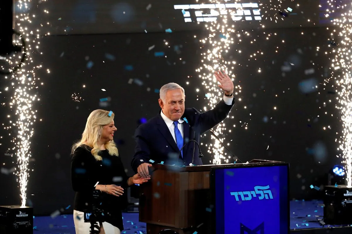 Confetti falls as Israeli Prime Minister Benjamin Netanyahu and his wife Sara stand on stage after Netanyahu spoke following the announcement of exit polls in Israel's parliamentary election at the party headquarters in Tel Aviv, Israel, on April 10, 2019. (Ronen Zvulun/Reuters)