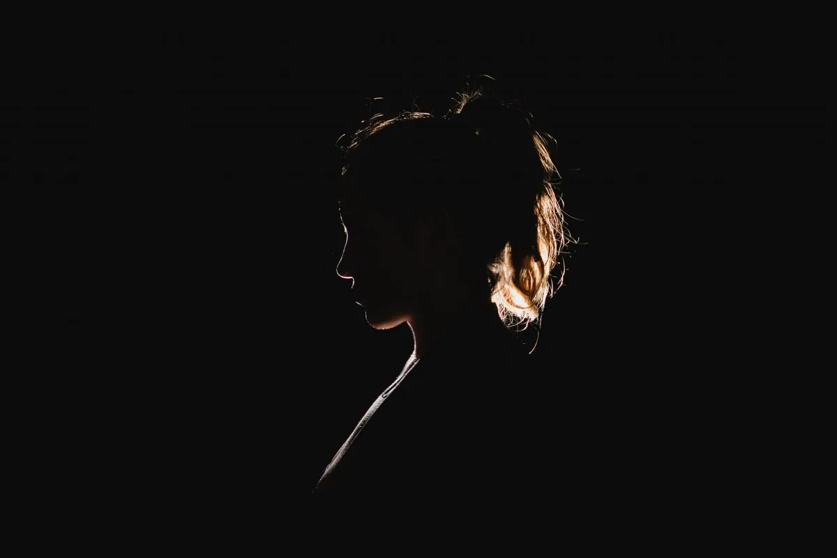 Silhouette of a woman. (Molly Belle/Unsplash)