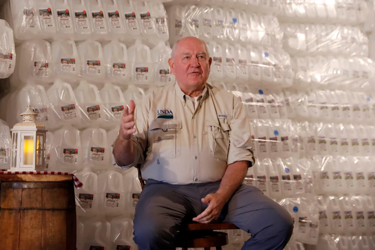U.S. Agriculture Secretary Sonny Perdue speaks to dairy farmers at Trinity Valley Dairy in Cortland, New York, U.S. on Aug. 23, 2018. (Shannon Stapleton/Reuters)