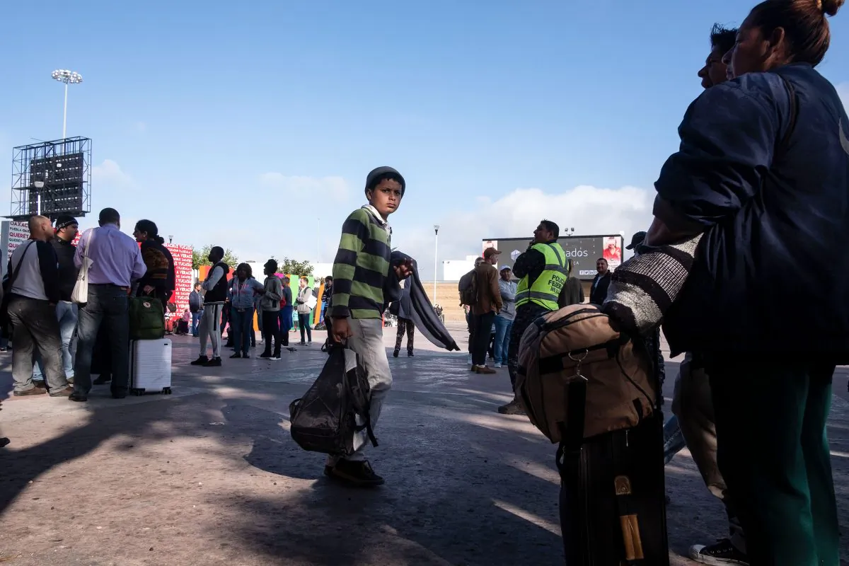 Asylum seekers wait for their turn to request asylum to US authorities outside El Chaparral port of entry in Tijuana, Baja California state, Mexico, on April 9, 2019. (Guillermo Arias/AFP/Getty Images)