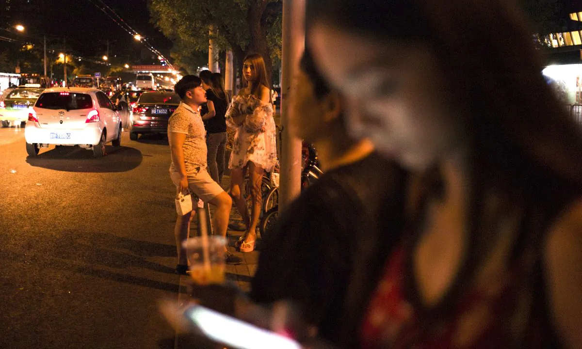 Couples in China. (FRED DUFOUR/AFP/Getty Images)