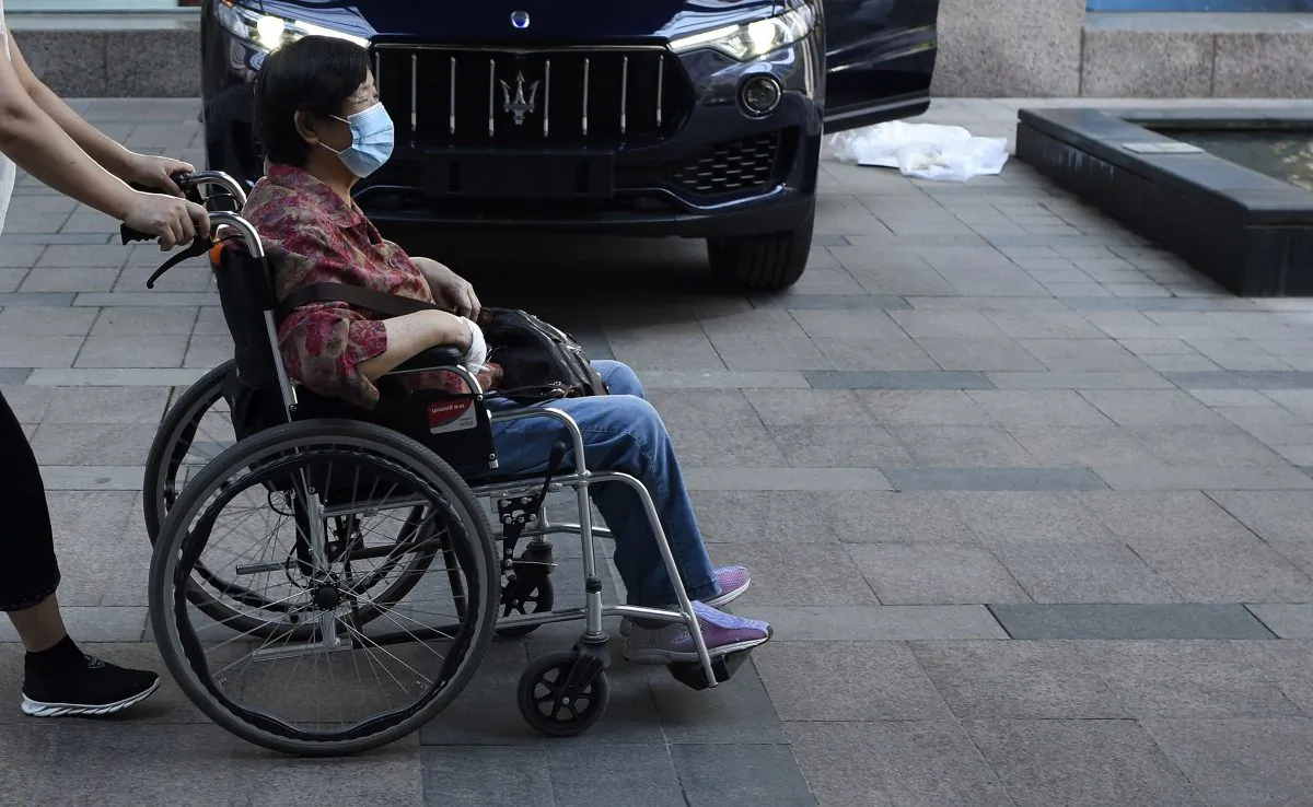 A woman pushed in her wheelchair in China. (WANG ZHAO/AFP/Getty Images)