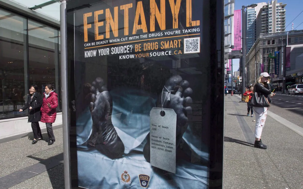 An anti-fentanyl advertisement is seen on a sidewalk in downtown Vancouver in this file photo. New government figures show that between January 2016 and September 2018, more than 10,300 Canadians died from apparent opioid overdoses, with men the most likely victims and fentanyl the primary culprit. (The Canadian Press/Jonathan Hayward)