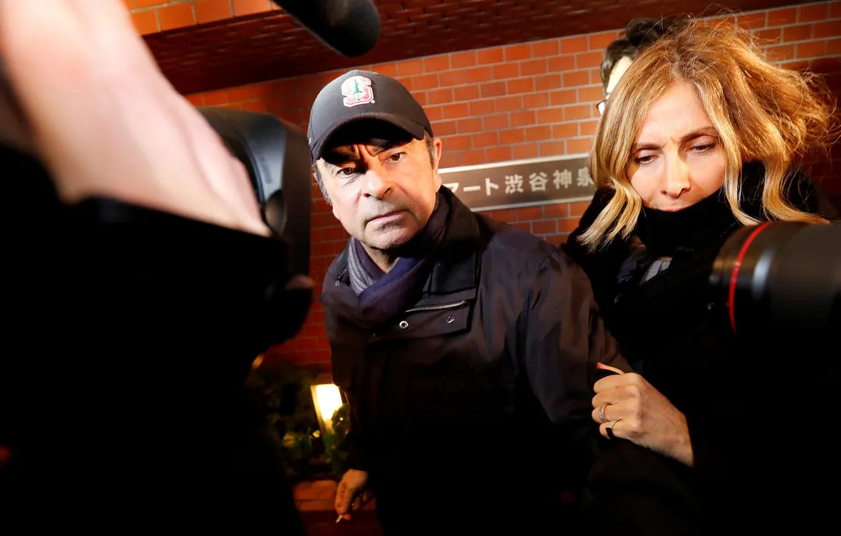 Former Nissan Chairman Carlos Ghosn accompanied by his wife, Carole, in Tokyo on March 8, 2019. (Issei Kato/Reuters)