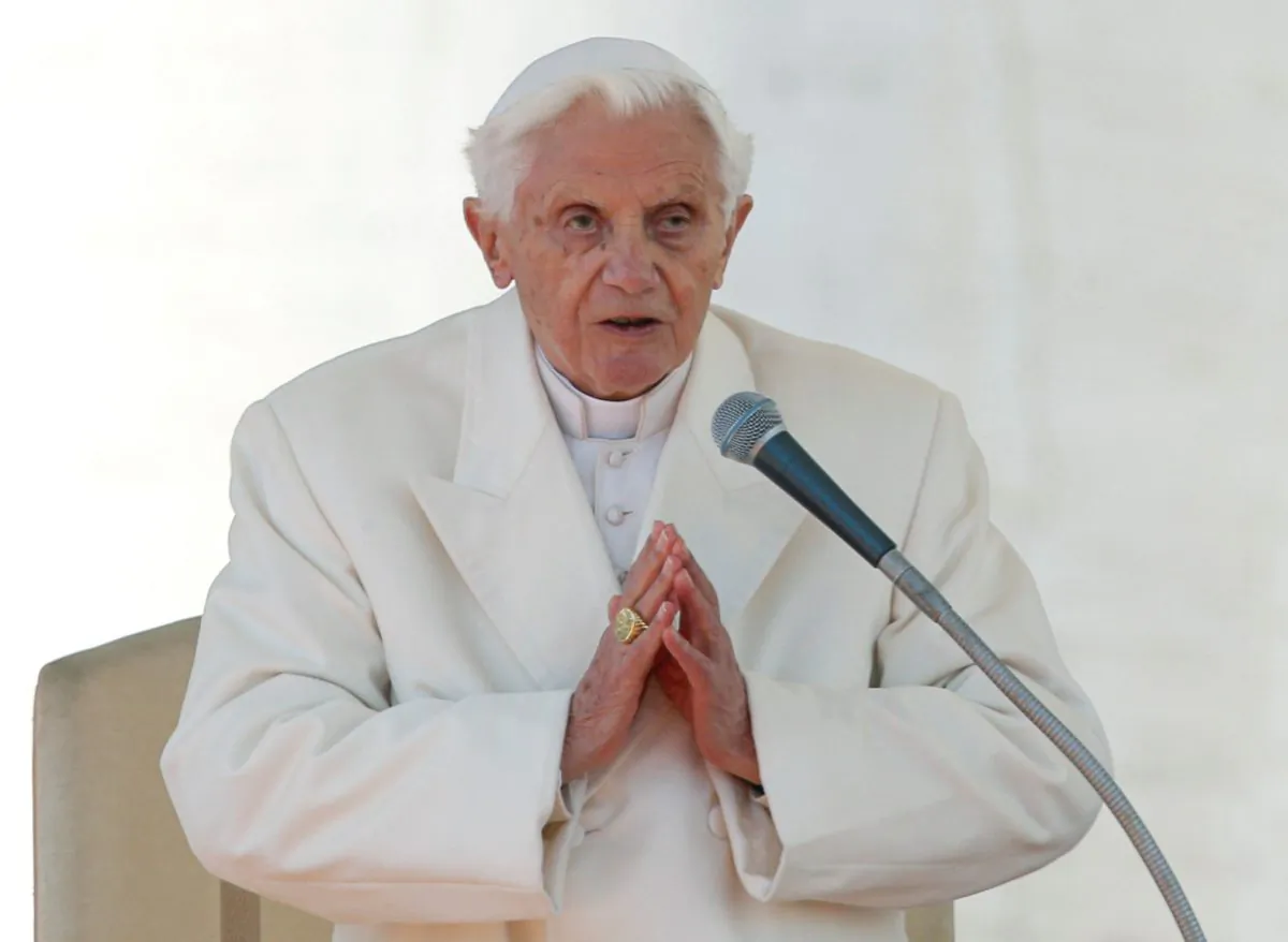 Pope Benedict XVI finishes his last general audience in St Peter's Square at the Vatican on Feb. 27, 2013. REUTERS/Alessandro Bianchi/File Photo