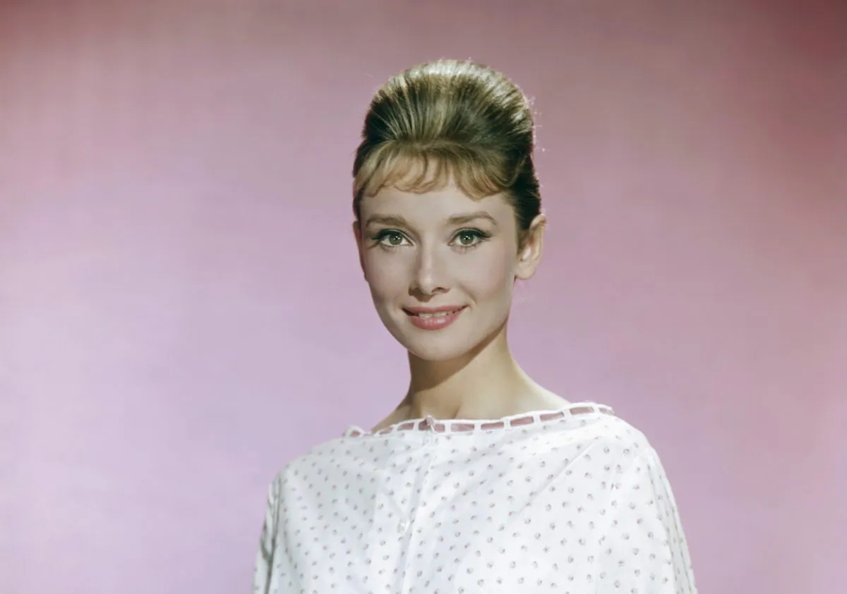 Audrey Hepburn (1929 - 1993), wearing a white blouse with pink flowers, circa 1963. (Archive Photos/Getty Images)