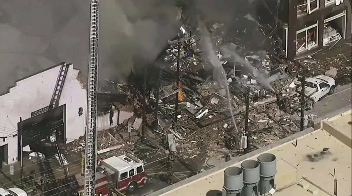 Firefighters and emergency officials respond to an explosion and fire in downtown Durham, North Carolina, on April 10, 2019. (WTVD-TV ABC 11 via AP)