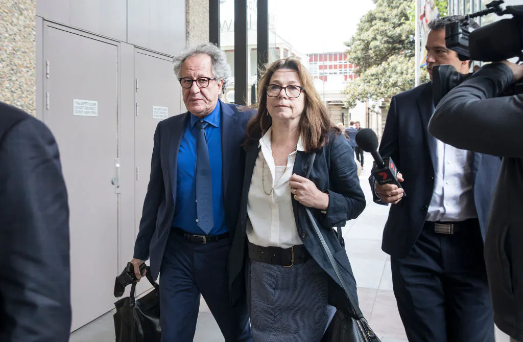 Geoffrey Rush leaves court with his wife Jane Menelaus on November 9, 2018 in Sydney, Australia. Geoffrey Rush is suing The Daily Telegraph for defamation over a series of articles that were published in late November and early December 2017 that alleged he behaved inappropriate during a 2015 stage production of King Lear. (Jessica Hromas/Getty Images)