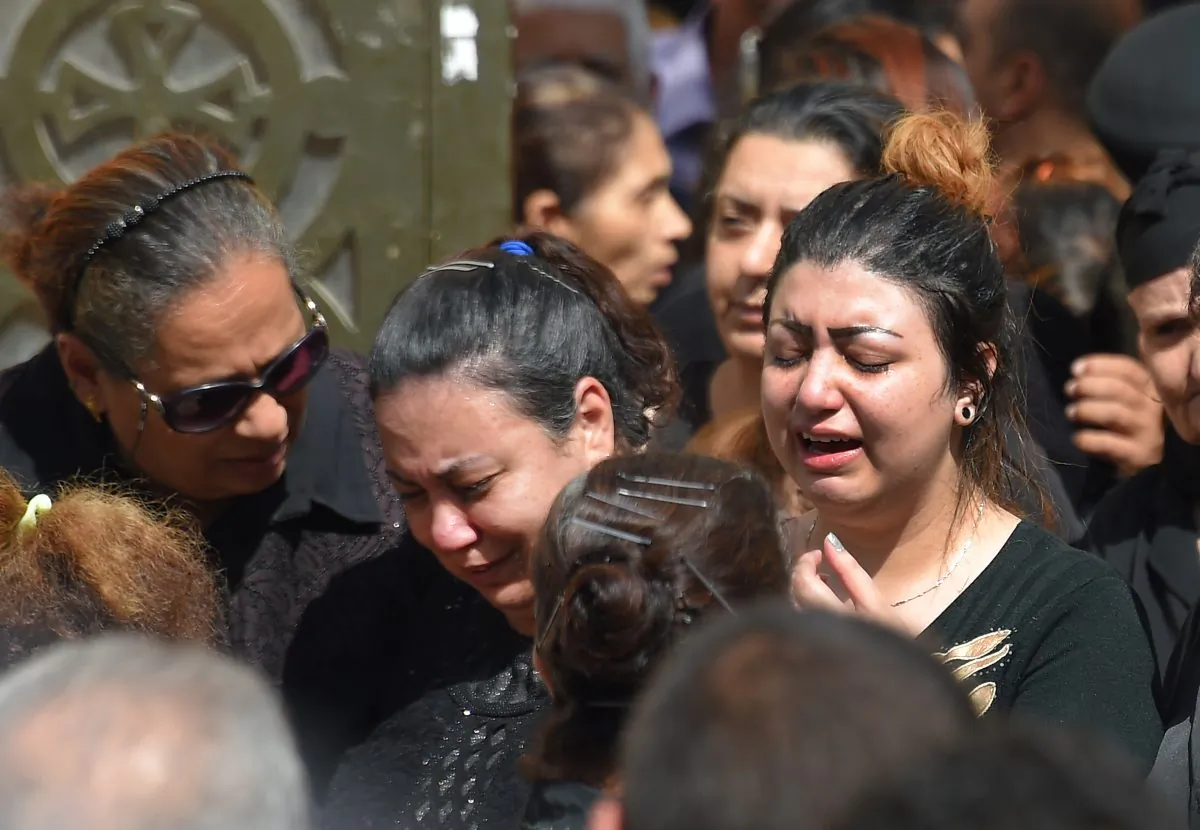 Coptic Christian women mourn victims killed in an attack a day earlier, as the coffins are carried out of the Prince Tadros church in Egypt's southern Minya province,following a morning ceremony on November 3, 2018. MOHAMED EL-SHAHED/AFP/Getty Images