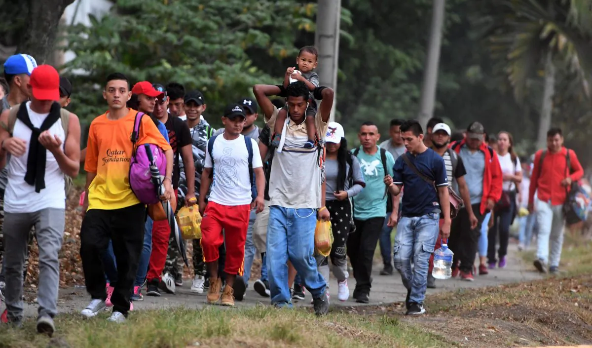 Honduran migrants leave the Metropolitan Center of San Pedro Sula, 300 kms north of Tegucigalpa, to travel to the Guatemala border on April 10, 2019. (ORLANDO SIERRA/AFP/Getty Images)