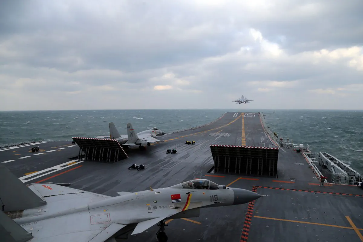 Chinese J-15 fighter jets being launched from the deck of the Liaoning aircraft carrier during military drills in the Yellow Sea, off China's east coast on Dec. 23, 2016. (STR/AFP/Getty Images)
