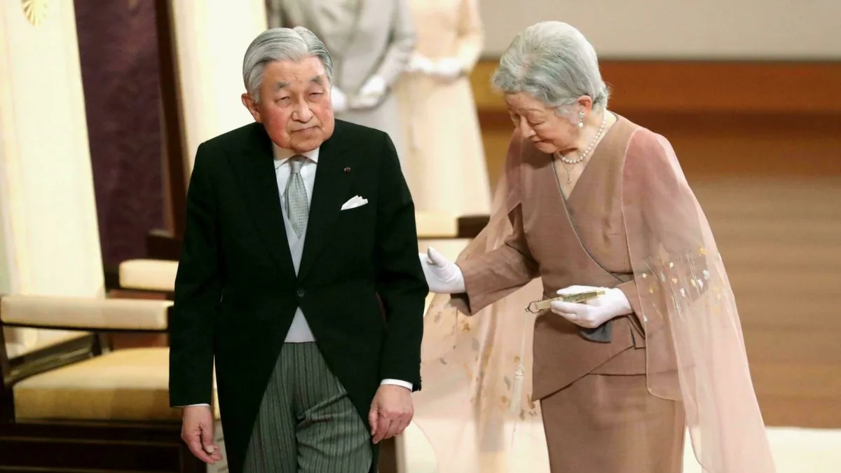 Japan's Emperor Akihito, left, and Empress Michiko, right, leave after the celebration ceremony of their 60th wedding anniversary at the Imperial Palace in Tokyo, on April 10, 2019. (Kyodo News via AP)