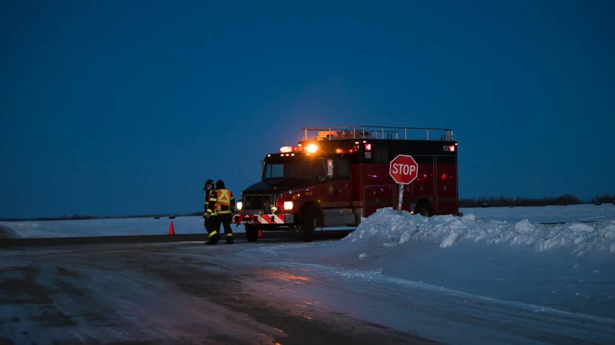 An emergency vehicle is seen near the crash site on April 6, 2018, after a bus carrying a junior ice hockey team collided with a semi-trailer truck near Tisdale and Nipawin, Saskatchewan province, killing 14 people. Saskatchewan's privacy commissioner has found eight people inappropriately accessed the electronic health records of ten Humboldt Broncos team members involved in the bus crash. (KYMBER RAE/AFP/Getty Images)