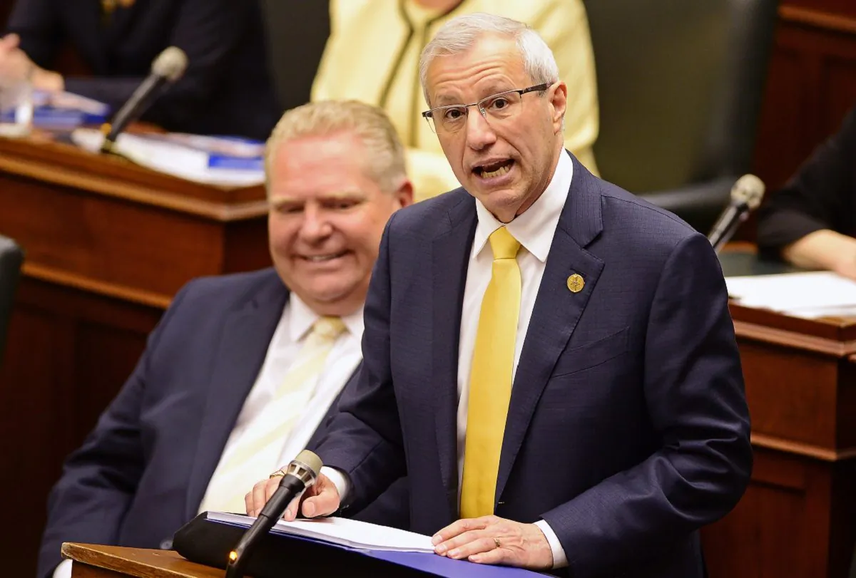Ontario Finance Minister Vic Fedeli presents the 2019 budget as Premier Doug Ford looks on, at the legislature in Toronto on April 11, 2019. (Frank Gunn/Canadian Press)