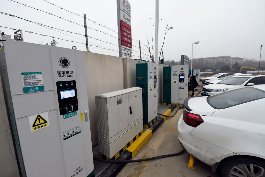 Electric cars charge at a Sinopec service station in Hangzhou, in China's eastern Zhejiang province on Jan. 14, 2019. The service station is one of the first in the country to offer petrol, compressed natural gas (CNG) and electric car charging service. (STR/AFP/Getty Images)
