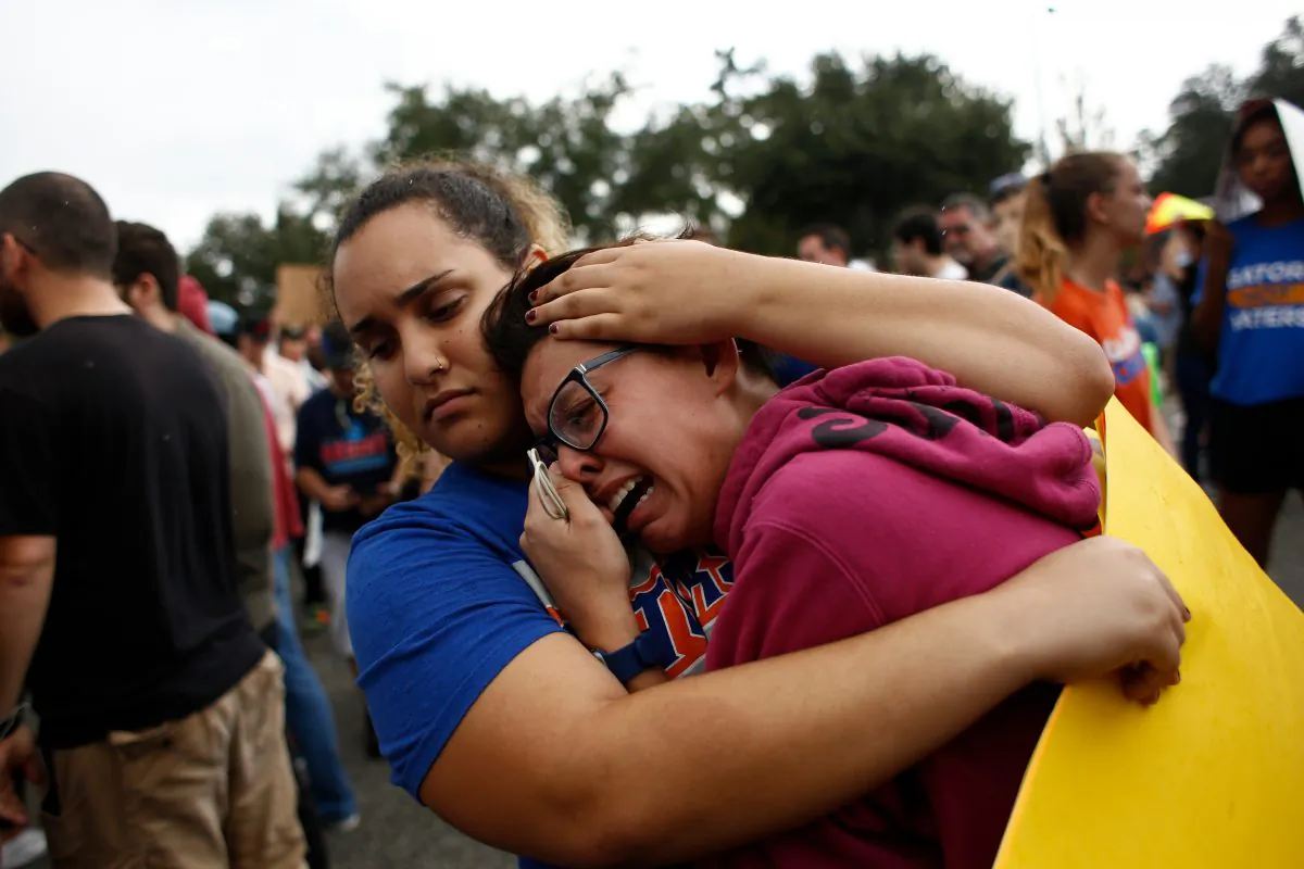A woman cries and is comforted by a demonstrator after she was refused entry into a planned speech by Richard Spencer, a white nationalist who popularized the term 'alt-right', at the University of Florida campus on October 19, 2017 in Gainesville, Florida. Brian Blanco/Getty Images
