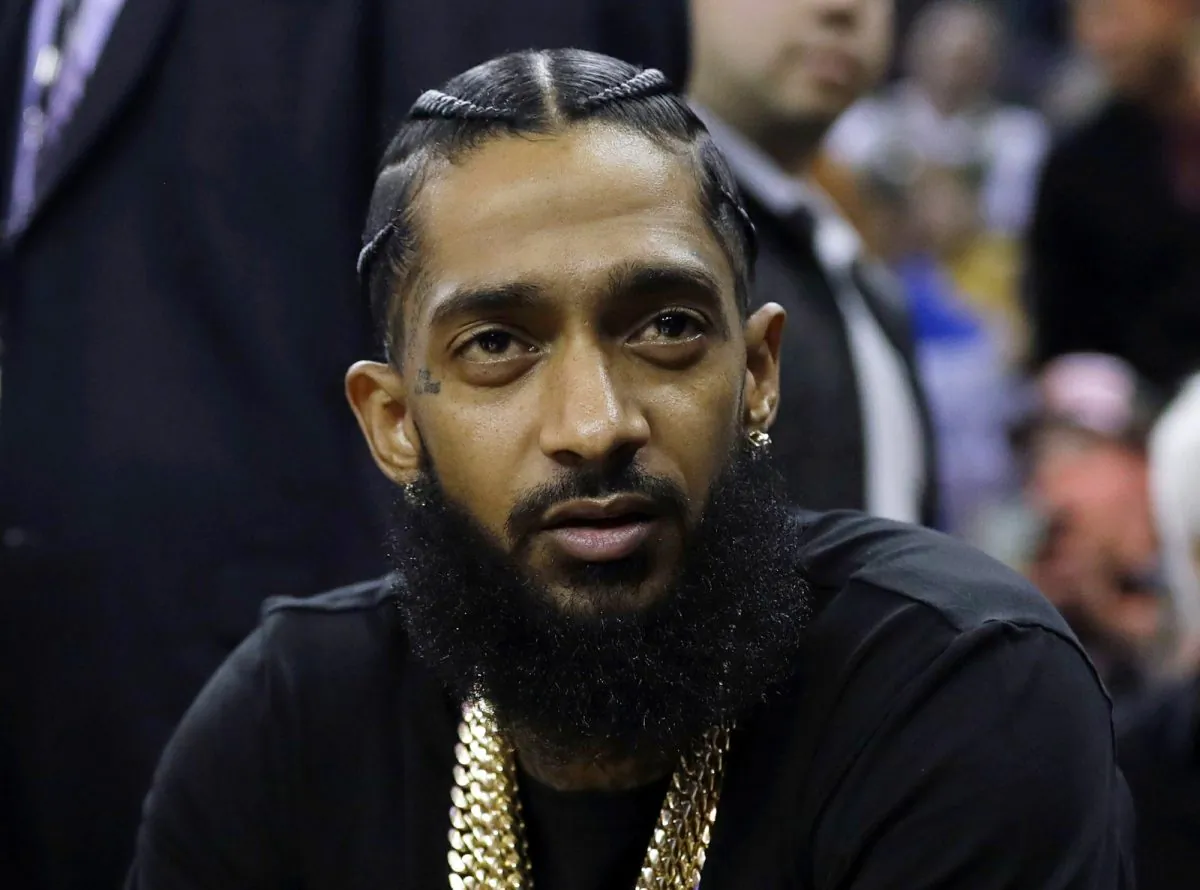 File photo showing late Rapper Nipsey Hussle at an NBA basketball game in Oakland, Calif., on March 29, 2018. (AP Photo/Marcio Jose Sanchez)