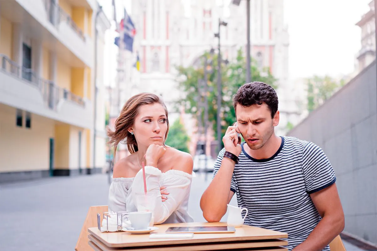 Checking one’s hand-held device in the company of another is a field that is rife with self-serving justifications: The general consensus is it’s a terrible thing to do—unless you’re the one doing it. (Shutterstock)