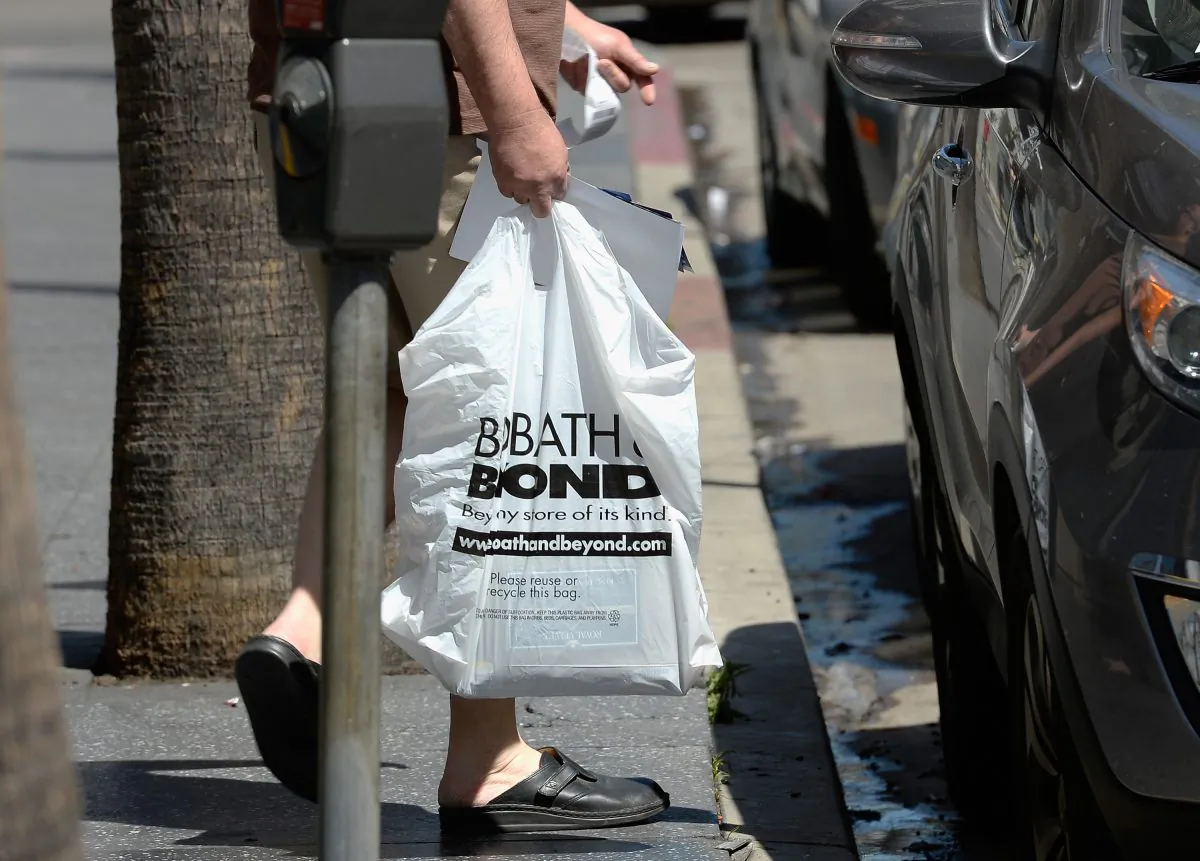 Customers carry bags from a Bed Bath & Beyond store in Los Angeles, Calif. on April 10, 2013. (Kevork Djansezian/Getty Images)