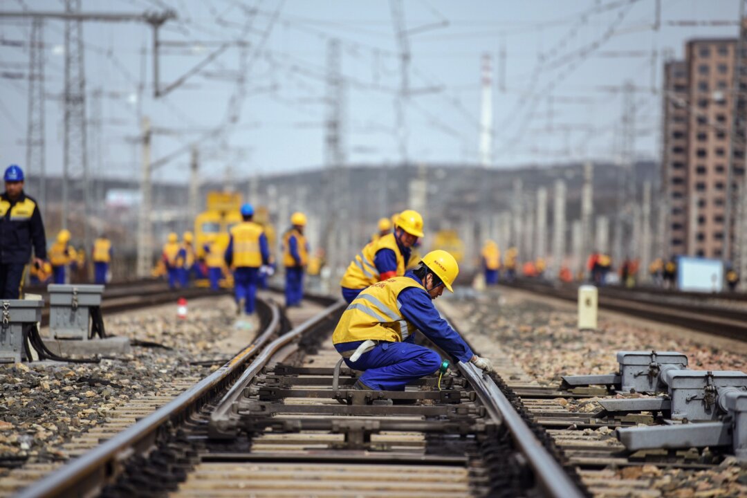 Workers are seen at a construction site of the Tangshan-Hohhot railway in Ulanqab, north China's Inner Mongolia region, March 19, 2019. China has drastically increased infrastructure spending in 2019. (STR/AFP/Getty Images)