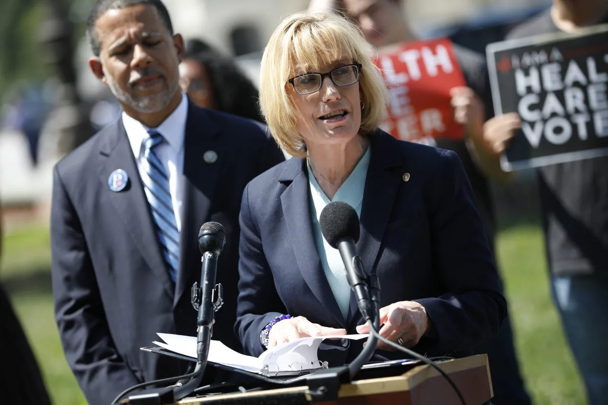 Sen. Maggie Hassan (D-N.H.) takes questions from reporters outside the U.S. Capitol on June 26, 2018, in Washington, D.C. about the Affordable Care Act. (Photo by Aaron P. Bernstein/Getty Images)