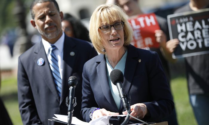 Sen. Maggie Hassan (D-N.H.) takes questions from reporters outside the U.S. Capitol on June 26, 2018, in Washington, D.C. about the Affordable Care Act. (Photo by Aaron P. Bernstein/Getty Images)