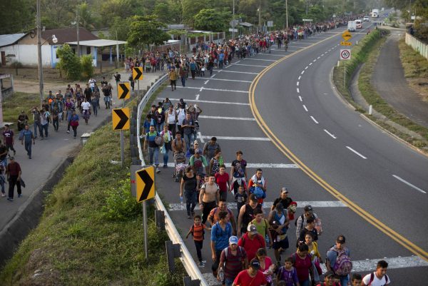 Migrants break border gate 1
