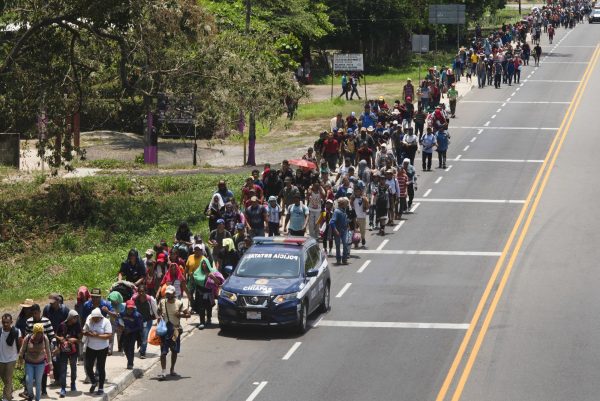 Migrants break border gate 2