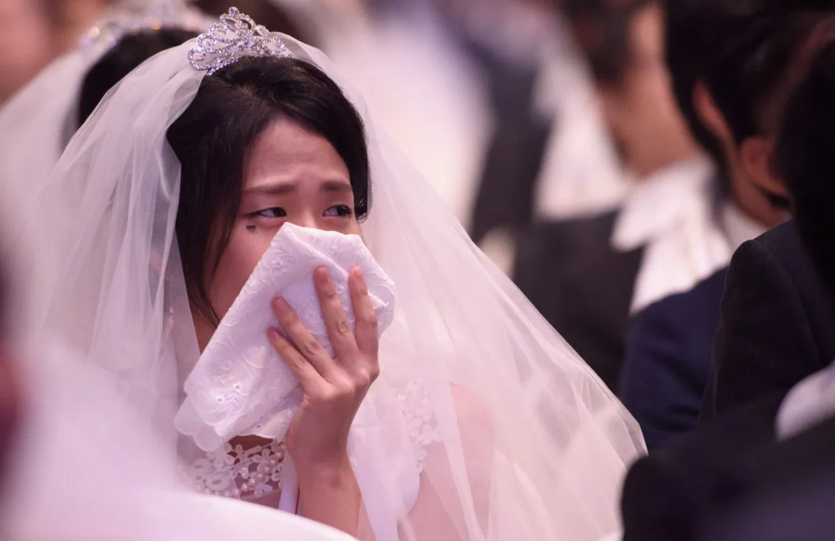 A woman cries at a wedding. (ED JONES/AFP/Getty Images)