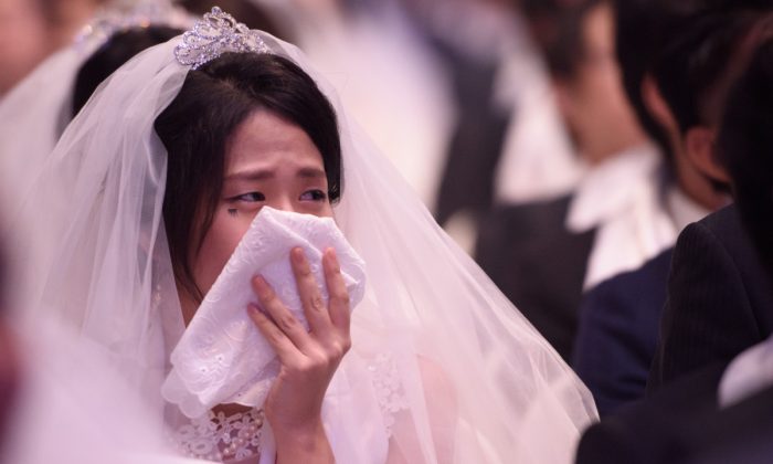 A woman cries at a wedding. (ED JONES/AFP/Getty Images)