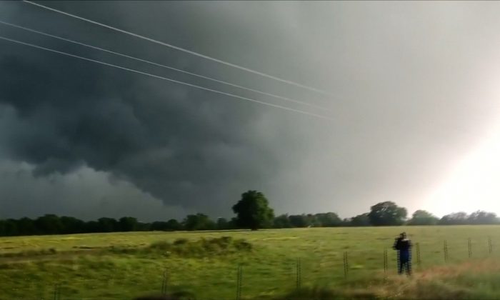 Dark clouds spiraled over a small town in Texas before turning into a tornado which injured at least seven people south east of Franklin, Texas, on April 13, 2019. (TWITTER @DOC_SANGER via Reuters)