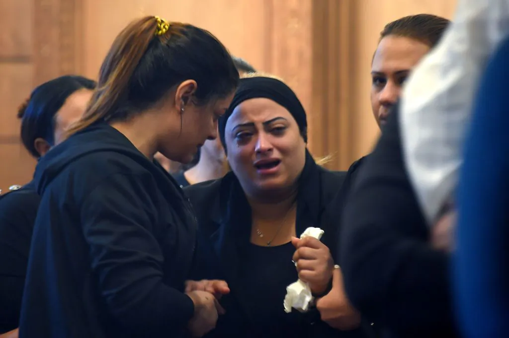 A Coptic Christian woman mourns victims killed in an attack a day earlier, during an early morning ceremony at the Prince Tadros church in Egypt's southern Minya province, on November 3, 2018. MOHAMED EL-SHAHED/AFP/Getty Images