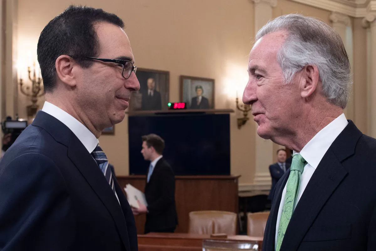 Treasury Secretary Steven Mnuchin (L) speaks with Chairman of the House Ways and Means Committee, Richard Neal, on March 14, 2019, on Capitol Hill in Washington. (Jim Watson/AFP/Getty Images)
