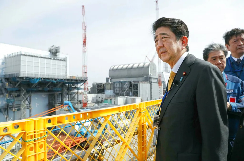 Japanese Prime Minister Shinzo Abe visits Fukushima Dai-ichi nuclear power plant in Okuma, Fukushima prefecture, Japan, on April 14, 2019. (Kyodo News via AP)