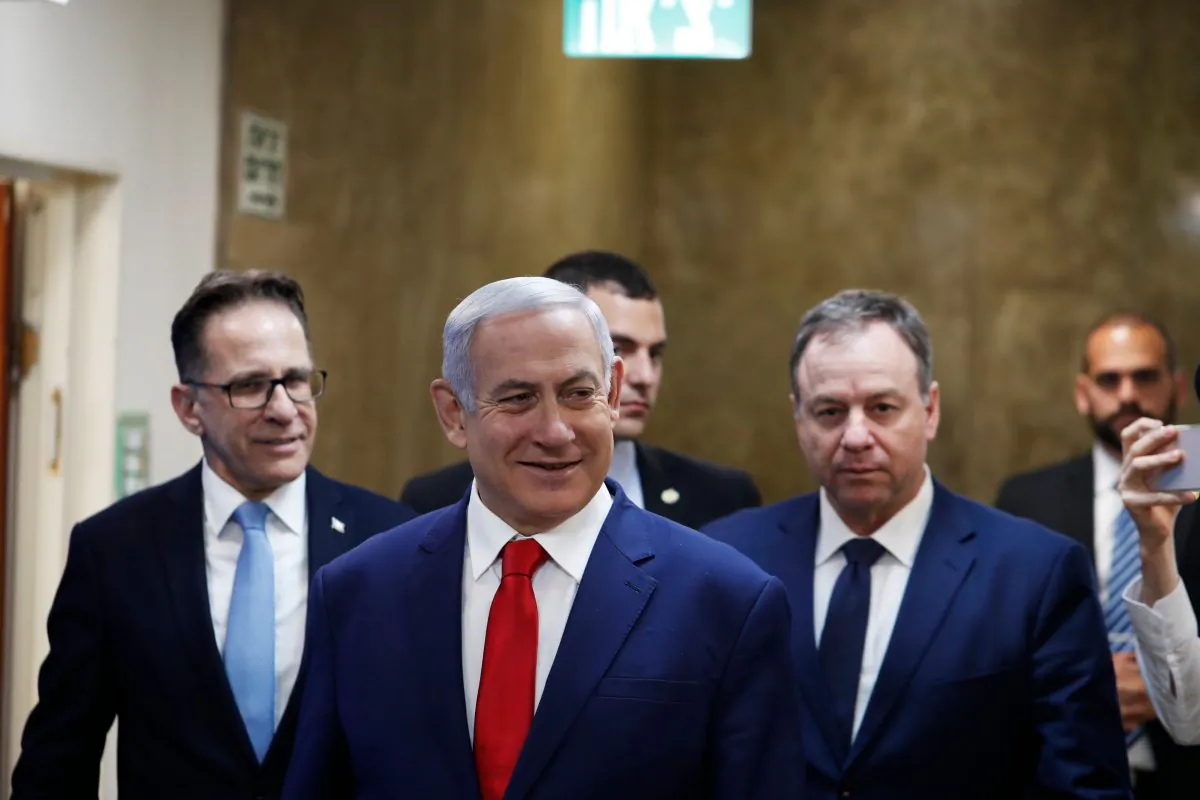Israeli Prime Minister Benjamin Netanyahu (C) arrives for the weekly cabinet meeting in Jerusalem on April 14, 2019. RONEN ZVULUN/AFP/Getty Images