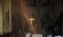 French Priest Who Ran Into Burning Notre Dame to Save Crown of Thorns Hailed as Hero