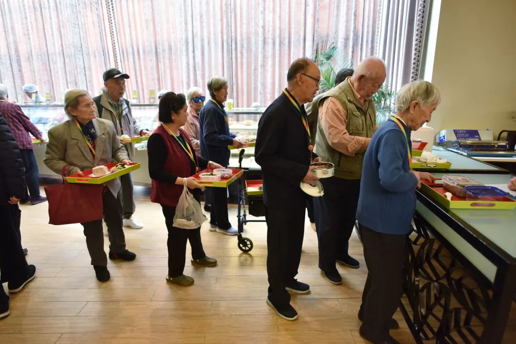 Residents line up for lunch at the Yanyuan community center for senior citizens, on the outskirts of Beijing, on December 5, 2018.  (Greg Baker/AFP/Getty Images)