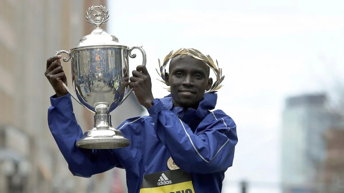 Lawrence Cherono, of Kenya, holds the trophy after winning the 123rd Boston Marathon, in Boston on April 15, 2019. (Winslow Townson/AP Photo)