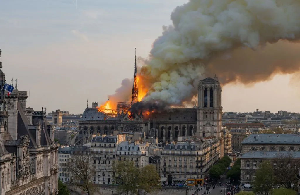 Smoke billows as flames burn through the roof of the Notre Dame de Paris Cathedral in Paris, on April 15, 2019. (Fabien Barrau/AFP/Getty Images)