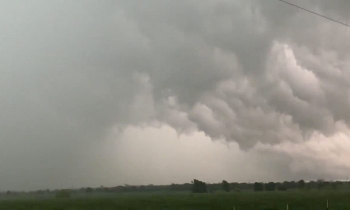 A view of clouds, part of a weather system seen from near Franklin, Texas, U.S., in this still image from social media video dated April 13, 2019. (Twitter@DOC_SANGER/via Reuters)