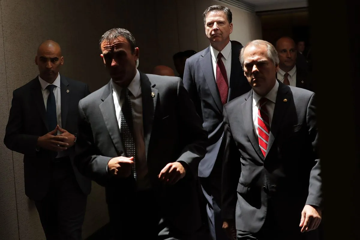 Former FBI Director James Comey (2R) moves from an open hearing to a closed hearing during a break in testimony before the Senate Intelligence Committee in the Hart Senate Office Building on Capitol Hill in Washington, DC. on June 8, 2017. (Chip Somodevilla/Getty Images)