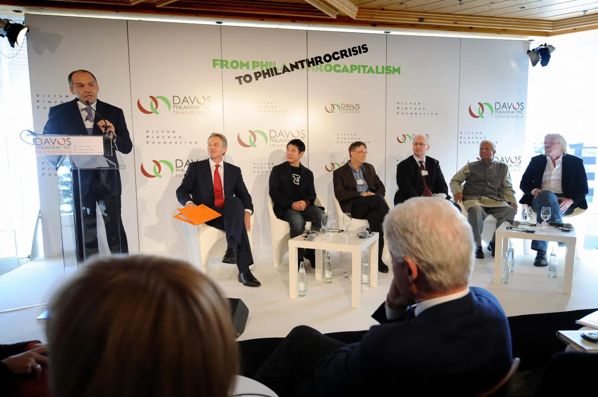 Victor Pinchuk, founder of EastOne and of the Victor Pinchuk Foundation talks as former President Bill Clinton (R) listens in Davos, Switzerland, on Jan. 29, 2009. (Fabrice Coffrini/AFP/Getty Images)