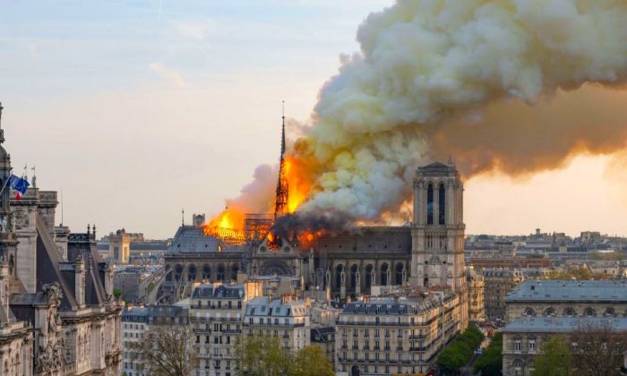 Smoke billows as flames burn through the roof of the Notre-Dame de Paris Cathedral in the French capital of Paris, on April 15, 2019. (Fabien Barrau/AFP/Getty Images)