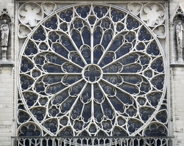 One of the iconic stained glass windows of the Notre Dame Cathedral in Paris