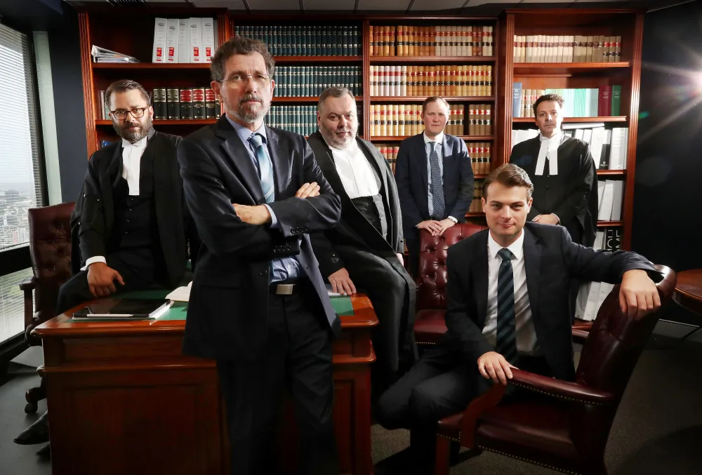 Former JCU geophysicist Peter Ridd with his legal team. (Peter Ridd/IPA)