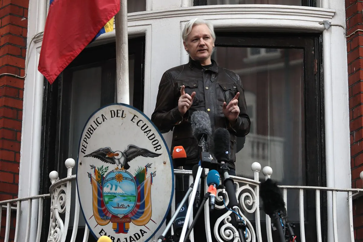 Julian Assange speaks to the media from the balcony of the Embassy of Ecuador in London on May 19, 2017. (Jack Taylor/Getty Images)