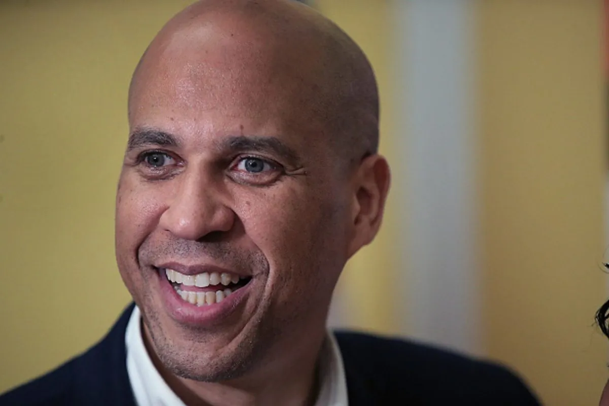 Democratic presidential candidate Sen. Cory Booker (D-N.J.) greets guests at a Black Caucus Reception hosted by the Iowa Democratic Party at the Polk County Central Senior Center in Des Moines, Iowa, on April 16, 2019. (Scott Olson/Getty Images)