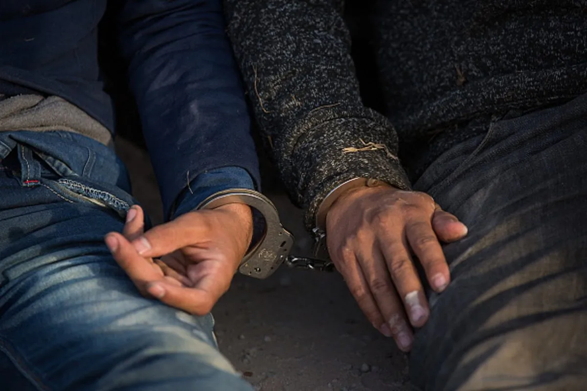 After being apprehended by Border Patrol, illegal immigrants wait to be transported to a central processing center shortly after they crossed the border from Mexico into the United States on Monday, in the Rio Grande Valley Sector near McAllen, Texas, on March 26, 2018. (Loren Elliott/AFP/Getty Images)